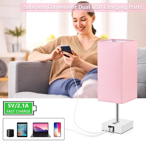 Woman using Pink Touch Control Table Lamp With 3 Way Dimmable Brightness And USB A And USB C Ports, White Base Modern Nightstand Light