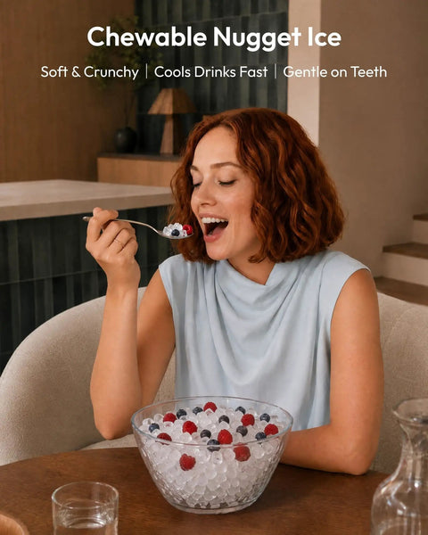 Woman enjoying fresh nugget ice from a bowl, highlighting the soft sonic pebble ice from the Fresh Freeze Countertop Nugget Ice Maker Yields 42 Lbs Soft Sonic Pebble Ice In Minutes With Smart App Alexa Hookup Self Cleaning Portable Pick For Home Office And Backyard Hangouts.