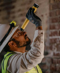 Person with hard hat using PolyStinger LED Haz Lo Intrinsically Safe Rechargeable Flashlight With 120 Volt AC And 12 Volt DC Charger