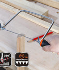 Coping Saw Kit With Frame And Two Extra Six And A Half Inch Blades, 15TPI High Speed Steel Blades cutting a wood piece on a workbench.