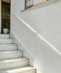 Slick Stainless Steel Flush Handrail Wall Mounted With Clean Silver Finish Provides A Heavy Duty Secure Grip For Stairs Straight Install Supports Up To Two Hundred Pounds Smooth Modern Design For Steady Daily Confidence on outdoor steps.