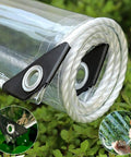 Rolled Beefed-Up Heavy Duty 14Mil Clear Tarp 3x6ft With Grommets on grass, showcasing tear-resistant edges and waterproof feature