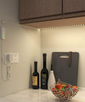 32.8 Ft Dimmable LED Under Cabinet Lighting Kit With 2 Rolls Of 16.4 Ft Each installed in kitchen, illuminating countertop