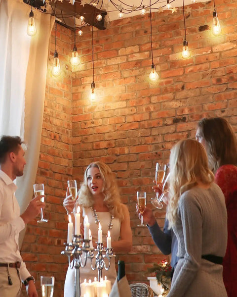 Cozy gathering under Smart Edison Bulbs WiFi LED E26 Dimmable ST64 Vintage Filament Light Bulb 45W 2200K amber glow