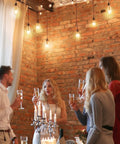 Cozy gathering under Smart Edison Bulbs 4 Pack WiFi LED E26 Edison Bulbs And ST19 Vintage Filament Dimmable 45W Equivalent 2200K lights.