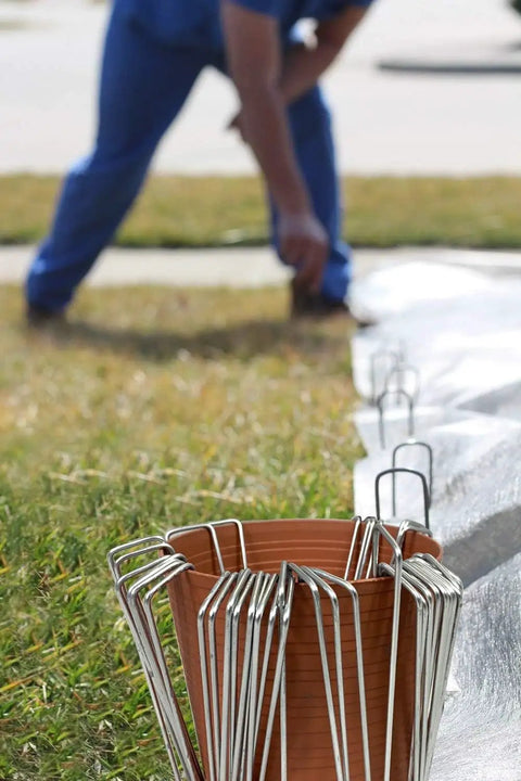 Heavy Duty Galvanized Garden Stakes And Landscape Staples 6 Inch 11 Gauge 500 Pack used for securing landscaping fabric.