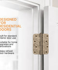 Top Shelf Floral Door Hinges 4 5/8 Inch Laser Etched Decorative Hardware For Interior Residential Doors installed on a white door.