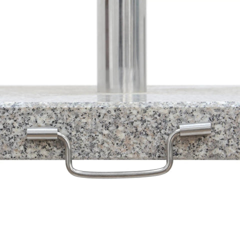 Close-up of Heavy Duty Granite Patio Umbrella Base With Handle And 2 Casters, showing metal handle on grey stone