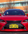 Front License Plate Mounting Kit With Black Aluminum Frame And Plastic Bumper Tag Adapter on red car