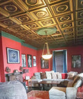 Dope Ceiling Upgrade In Hours With Laurel Wreath PVC 2x2 Tile Lay In Or Glue Up Silver Finish in a cozy living room.