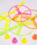 Colorful flying discs with swirly sticks and rings from 50 Pack Flying Disc Toy Set With Swirly Sticks, Spinners, And Rings.
