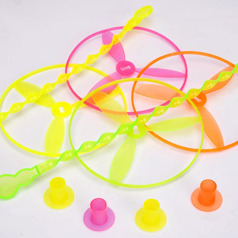 Colorful flying discs with swirly sticks and rings from 50 Pack Flying Disc Toy Set With Swirly Sticks, Spinners, And Rings.