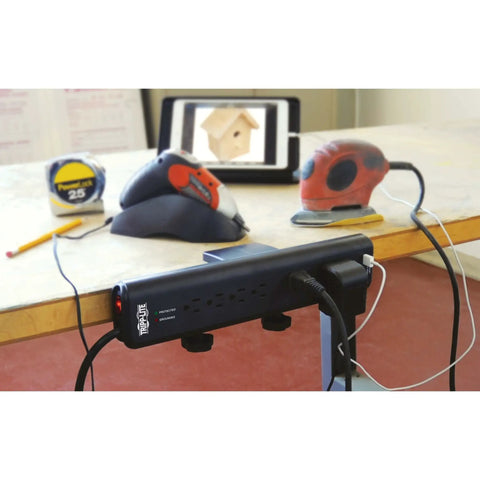 6-Outlet Surge Protector Power Strip With Desk Clamp Mount 6 Ft Cord 2100 Joules Protection on a workshop table