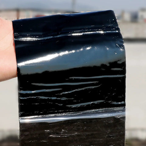 Beat The Elements With This Heavy Duty Roof Underlayment Roll And Bitumen Waterproofing Membrane Self Adhesive Flashing Tape glistening black roll held up.