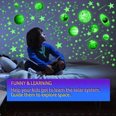 Child gazing at glow in the dark stars and planets ceiling decals for bedroom and living room space wall stickers with solar system planets ideal gift for kids toddlers boys and girls cool night sky decor.