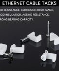 Close-up of 100 Pack 8mm Ethernet Cable Clips With Nails For Cat6 Cat7 Flat Cables White Durable UV Stabilized Plastic Cord Holders
