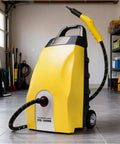 3.5L High Pressure Steam Cleaner With 8 Accessories Fast 40S Heat Up For Home And Car Deep Cleaning Range Hood And Air Conditioner Eco Friendly Pet Safe Heavy Duty Grease Removal Machine in a garage with hose attached.