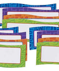 Set of 20 colorful Magnetic Name Plates For Desks And Classrooms Reusable Dry Erase Name Tags in orange, green, blue, and purple.