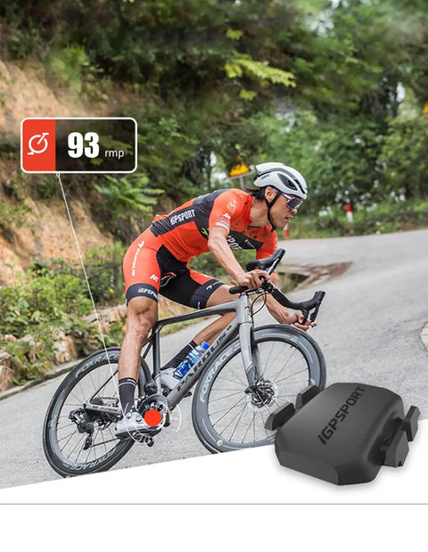 Cyclist using Speed And Cadence Sensor Bundle with Bluetooth 5.0 and ANT Plus on mountain road, displaying 93 rpm reading.