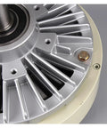 Electromagnetic brake clutch unit with silver metal housing and beige outer ring; close-up view of center shaft bearing