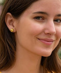 14K Yellow Gold Ball Stud Earrings 5mm No Tarnish Hypoallergenic Everyday Jewelry For Work And Dress Up Classic Polished Gold Balls That Won't Fade Or Turn Your Ears Green on a model