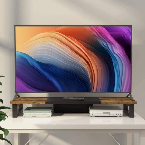 Heavy Duty Dual Monitor Stand Riser in wood and steel with rustic brown finish, shown with TV on white desk