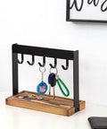 Solid Five Hook Table Key Holder With Torched Wood Base And Rustic Industrial Countertop Rack in black and wood, holding keys and coins.