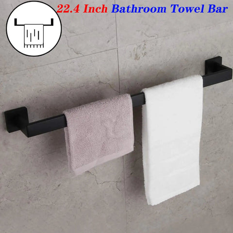 24 Inch Contemporary Stainless Steel Towel Bar Wall Mount With Slick Matte Black Finish holding towels in a bathroom setting