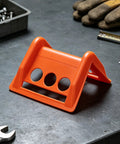 Orange 20 Pack Plastic Flatbed Edge And Corner Protectors For Trucks with sturdy design on workbench.