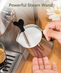 Hand using steam wand on 20 Bar Dual Mode Espresso Machine With Portafilter For Nespresso Original Capsules Or Ground Coffee