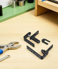 Heavy Duty Double-Sided Self-Closing Door Hinges With Spring Mechanism, Black Finish, Smooth Steel Build, For Interior And Exterior Bar Doors, Easy One-Handed Self-Closing Action, Ideal Hardware For Bar Counter, shown with tools
