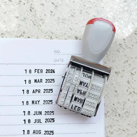Totally Versatile Rubber Date Stamp With Rotating Mechanism For Scrapbooking And Office Tasks on paper with marked dates.