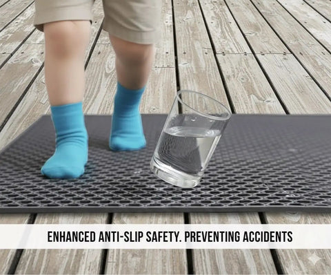 Child's feet on Heavy Duty Non Slip Floor Mat 4X10 Grey Drainage Rubber Deck Mat For Commercial Bars Kitchens And Pools anti-fatigue surface.