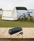 Heavy Duty ABS Plastic Electric Bike Controller Box Keeps Your Ride Tight For 1000 To 1500 Watt Ebike Motor Setups With Included Nuts And Fasteners on wooden table near bike and tent.