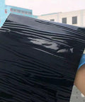 Super Tough Self Adhesive Roofing Felt Polyethylene Underlayment Roll For Asphalt Shingles and Driveway Patching, glossy side visible.
