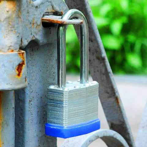 Outdoor gate secured with Two Pack Heavy Duty Padlocks Keyed Alike With Extra Long Two And Three Eighths Inch Shackle And Forty Millimeter Laminated Steel Lock Bodies Ideal For Gym Lockers Sheds Gates Warehouses Tool Boxes Hasps Includes Four Identical Keys