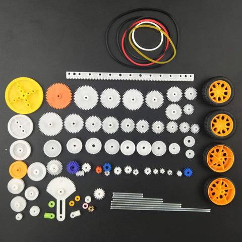 82 Piece Plastic Gear Kit For DIY Toy Cars And Robots Complete Gear Pack With various gears, axles, tires, belts on display.
