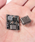 Hand holding 10 Pack Type C USB 5V 2A Boost Converter Step Up Power Module With LED Display For Lithium Battery Charging DIY Charger
