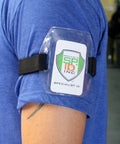 Premium Solid Durable Armband Badge Holder With Hella Secure Stretchy Strap And Easy Hook Loop Fastener For Work Credentials Cards And Passes One Size Fits on blue shirt.