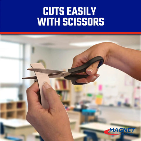 Hands using scissors to cut Roll N Cut Flexible Magnetic Tape Refill With Crazy Sticky Adhesive Backing One Sixteenth Inch Thick