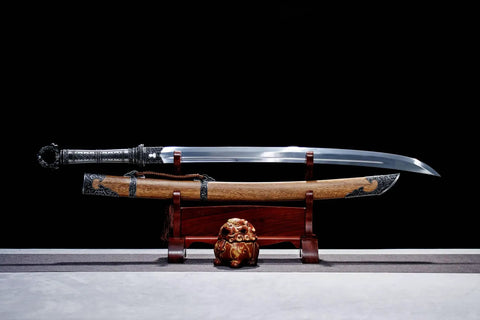 Xiuchun Dao Chinese Sabre Hand Forged Manganese Steel With Teak Wood Scabbard displayed on stand