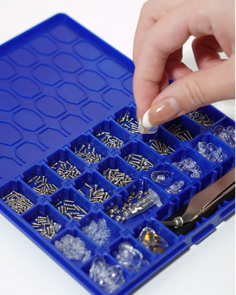 Complete Eyeglass Repair Kit With 1000 PCS In 32 Slot Blue Case showing assorted screws and tools in compartments.