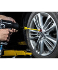 Using Half Inch Drive Torque Extension for Impact Wrench 8 Inch Extension with 65 Ft Lb Flex on car wheel