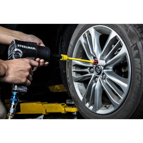 Using Half Inch Drive Torque Extension for Impact Wrench 8 Inch Extension with 65 Ft Lb Flex on car wheel