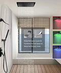 Top Shelf Matte Black LED Shower System Featuring Wide Rainfall Head And Ergonomic Hand Sprayer with waterfall spout in bathroom.