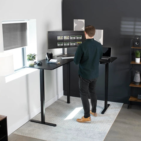Corner Standing Desk With Electric Height Adjustment 63 X 55 Inch Reversible L Shaped Workstation in home office setup