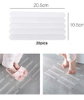 Person stepping on grey floor with Grippy Non Slip Bathtub And Shower Stickers Set 24 Pieces 8 By 0.8 Inch Anti Skid Treads Tape.