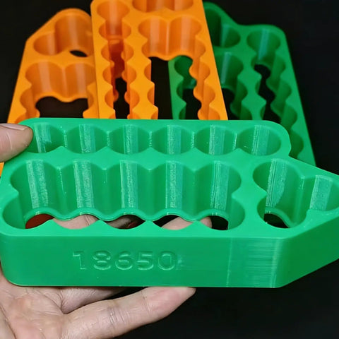 Slick Heavy Duty Spot Welding Jig For 18650 And 21700 Battery Packs - Green insulated holder with slots for cell stability.