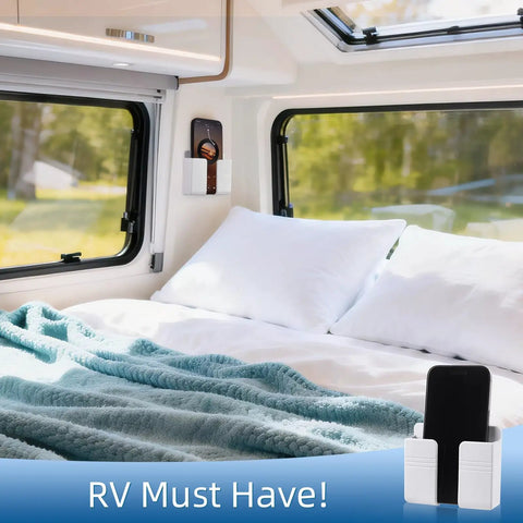 Wall Phone Holder For Camper RV Boat Two Pack White Heavy Duty Adhesive Mount in RV bedroom, phone on holder next to bed.