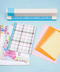 Adjustable 30 Hole Binding Punch For Discbound Notebooks And Journals with planners and pages on a desk